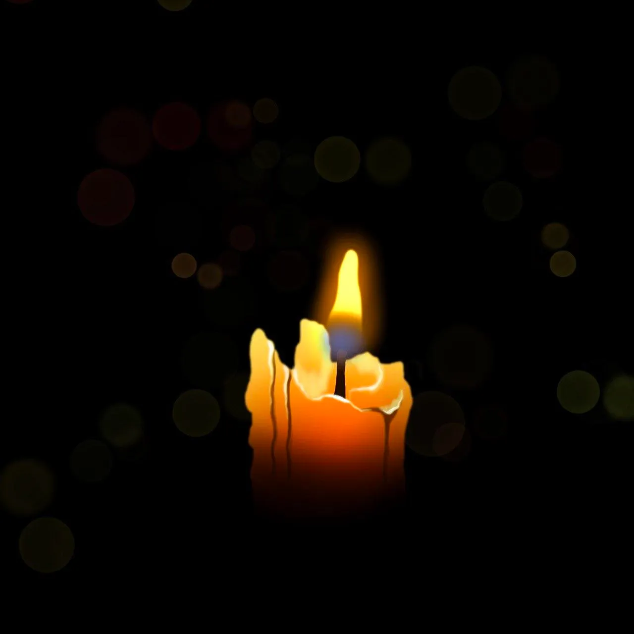 A short, melted candle burning in the dark.